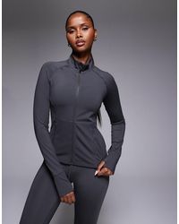 4505 - Icon Active Zip Up Sculpting Long Sleeve Jacket With Zip Pockets - Lyst