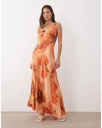 Never Fully Dressed - – sofia – maxikleid mit geknoteten trägern, schrägschnitt und verschwommenem blumenmuster - Lyst