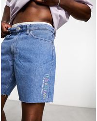 Calvin Klein - Pride - pantaloncini di jeans a metà coscia lavaggio azzurro - Lyst