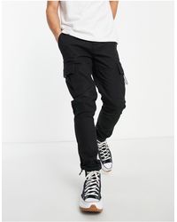 Pantaloni cargo skinny con tasche sul davanti color pietra da Uomo di  TOPMAN in Neutro | Lyst