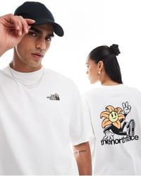 The North Face - Exclusivité asos - - t-shirt oversize avec imprimé fleur au dos - Lyst