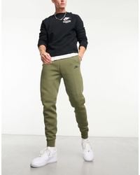 Nike - Joggers verde tech fleece winter - Lyst