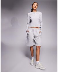 Kaiia - Exclusive Cotton Rich Button Front Long Sleeve Ribbed Top - Lyst