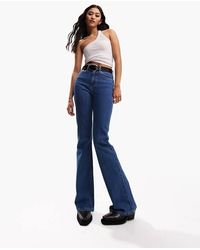 ASOS - Wijd Uitlopende Jeans Met Halfhoge Taille - Lyst