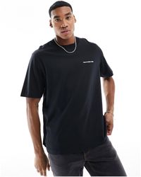 Abercrombie & Fitch - T-shirt nera con logo micro sul davanti - Lyst