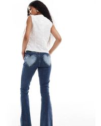 Miss Selfridge - Heart Pocket Flare Jean - Lyst