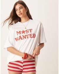 ASOS - Camiseta Color Crema Extragrande Con Estampado Gráfico De Estilo Wéstern Con Texto "Most Wanted" De -Blanco - Lyst