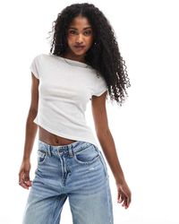 ASOS - Top A Maniche Corte Semitrasparente Color Avorio Con Orlo Asimmetrico - Lyst