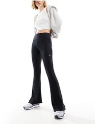 Nike - Mini-ribbed Flared leggings - Lyst