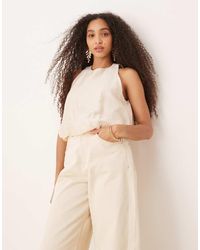Mango - Top Sin Mangas Con Cuello Redondo Y Bajo Abullonado De Tejido Suave De -Neutro - Lyst