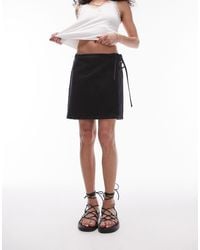 TOPSHOP - Denim Knee Length Wrap Skirt - Lyst