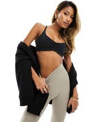 4505 - Light Support Ruched Front Strap Back Sports Bra - Lyst