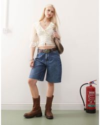 Reclaimed (vintage) - Bermuda baggy en jean à taille basse - moyen délavé - Lyst