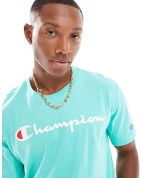 Champion - T-shirt à logo sur la poitrine - vert clair - Lyst