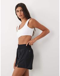 4505 - Active High Waist 2-In-1 Tennis Shorts With Ball Pocket - Lyst