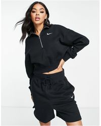Nike - Sudadera negra y blanca con cremallera corta y logo pequeño - Lyst