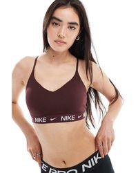 Nike - Sujetador Deportivo De Sujeción Ligera Dri-Fit Indy De -Rojo - Lyst