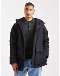 Fred Perry - Parka Negra Acolchada De - Lyst