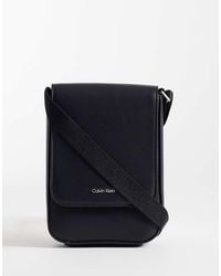 Calvin Klein - Jeans Raised Logo Crossbody Bag - Lyst