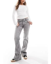 Stradivarius - Str Low Waist Flare Jeans - Lyst