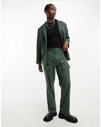 ASOS - Pantaloni da abito verdi ampi con tasche cargo - Lyst