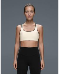 Oysho - Medium-support Comfortlux Sports Bra With Contrast Seams - Lyst