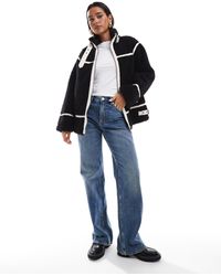 Miss Selfridge - – e pilotenjacke aus teddyfell - Lyst