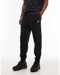 Nike - Club Cuffed Fleece joggers - Lyst
