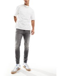 ASOS - Spray On Jeans With Power-stretch Denim With Rips And Panels - Lyst