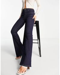 River Island - – amelie – jeans aus dunklem denim mit mittelhohem bund und ausgestelltem bein - Lyst