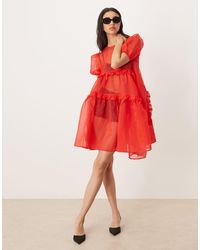 Ghospell - Exclusive Sheer Organza Puff Sleeve Tie Ruffle Asymmetric Hem Mini Dress - Lyst