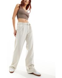 Pull&Bear - Pantaloni sartoriali a fondo ampio color sabbia con pieghe e cintura - Lyst