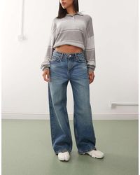 Weekday - Vaqueros De Talle Bajo Y Corte Suelto Con Lavado Azul Oscuro Y Tintado Verde Missy De - Lyst