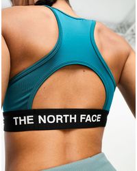 The North Face - Reggiseno sportivo tecnico da allenamento verde-azzurro a supporto medio - Lyst