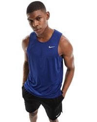 Nike - Camiseta azul real sin mangas dri-fit miler - Lyst