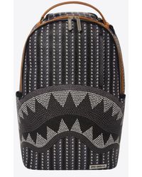 sprayground backpack in stores