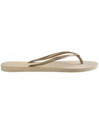 gold havaianas with diamante