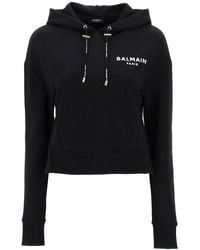 Balmain - Cropped Sweatshirt mit flockigem Logo -Druck - Lyst