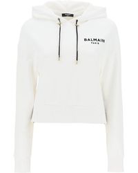Balmain - Cropped Sweatshirt mit flockigem Logo -Druck - Lyst