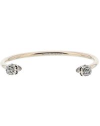 Alexander McQueen Brazalete con doble calavera de - Metálico