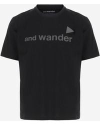 and wander - Baumwoll-T-Shirt mit Logo-Schriftzug - Lyst