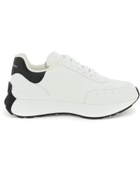 Alexander McQueen - Sneakers basse bianche con linguetta logo - Lyst