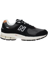 New Balance - Neue Balance Sneakers 2002 Frau Stoff schwarz/sepia - Lyst