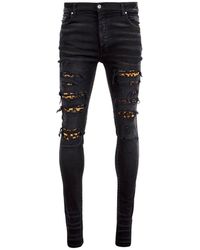 Amiri - Jeans en jean imprimé léopard - Lyst