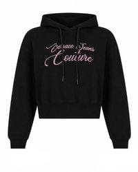Versace Jeans Couture - Cropped Drawstring Script Logo Cotton Hoodie - Lyst