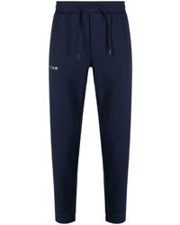 EA7 - Pantalones de chándal con logo estampado - Lyst