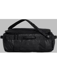 The North Face - Compact Travel Luggage Bag - Lyst