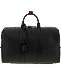 Gucci - Leather Emblem Travel Bag - Lyst
