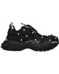 Versace - Mujers Zapatillas de Tela Negras - Lyst