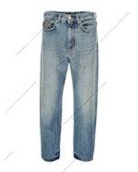 Versace - Cotton Jeans With Logo Detail - Lyst